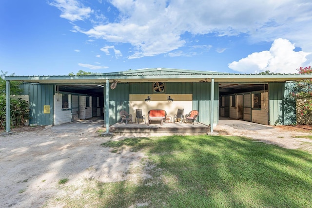 back of house with an outdoor structure