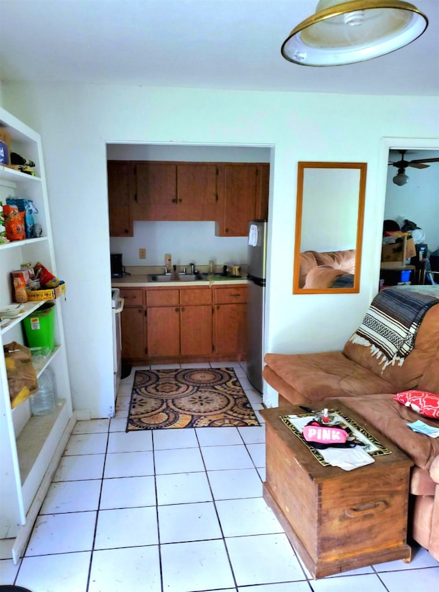 interior space featuring light tile patterned flooring and sink