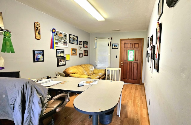 dining space with light hardwood / wood-style flooring