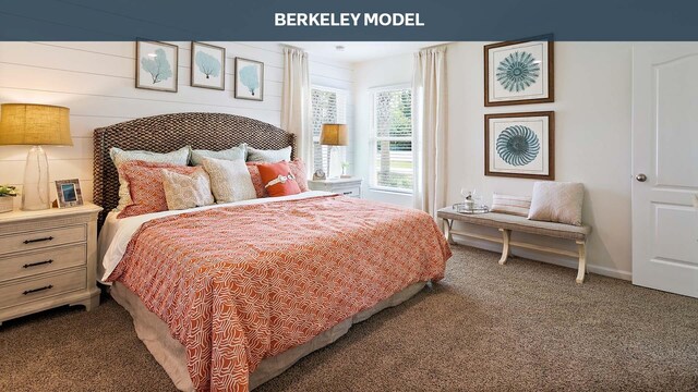 bedroom with wood walls and carpet