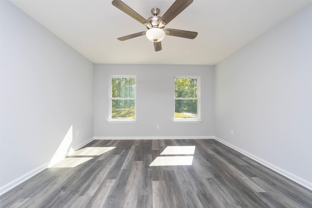 unfurnished room featuring ceiling fan and dark hardwood / wood-style flooring