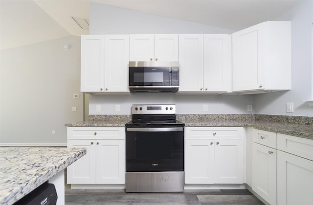 kitchen with light stone countertops, stainless steel appliances, dark hardwood / wood-style flooring, vaulted ceiling, and white cabinets