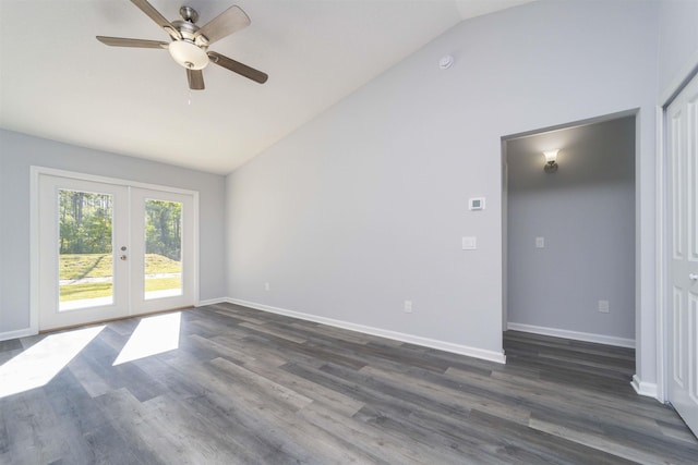 empty room with french doors, dark hardwood / wood-style floors, high vaulted ceiling, and ceiling fan