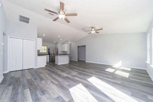 10690 Carpenter Ave, Hastings, FL 32145 - unfurnished living room featuring a ceiling fan, lofted ceiling, dark wood finished floors, and recessed lighting