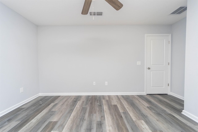 empty room featuring ceiling fan and wood-type flooring