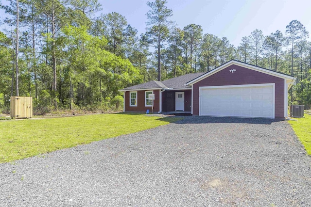 single story home with central AC, a garage, and a front lawn