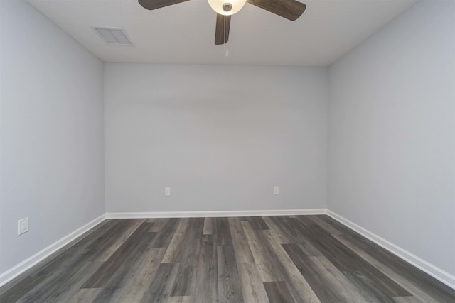 spare room featuring ceiling fan and dark wood-type flooring