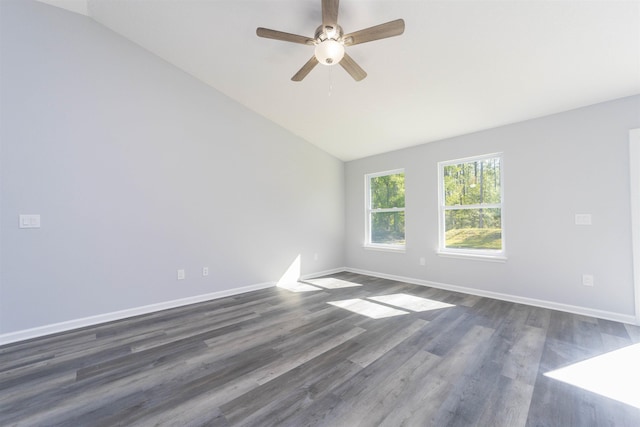 spare room featuring ceiling fan, dark hardwood / wood-style floors, and vaulted ceiling