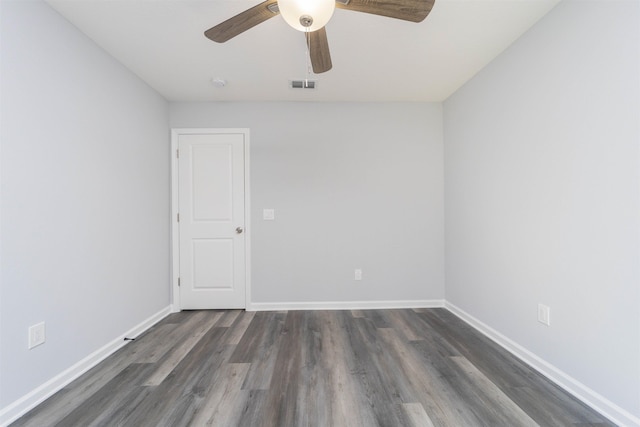 spare room featuring dark hardwood / wood-style floors