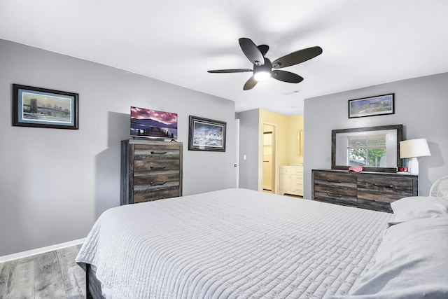 101 Vista Lagoon Ct Unit A-4, Ponte Vedra Beach, FL 32082 - bedroom featuring wood finished floors, baseboards, connected bathroom, and ceiling fan