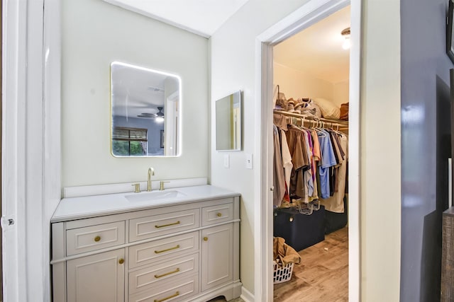 101 Vista Lagoon Ct Unit A-4, Ponte Vedra Beach, FL 32082 - bathroom with vanity, wood finished floors, and a walk in closet