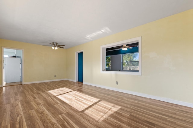 spare room with hardwood / wood-style floors