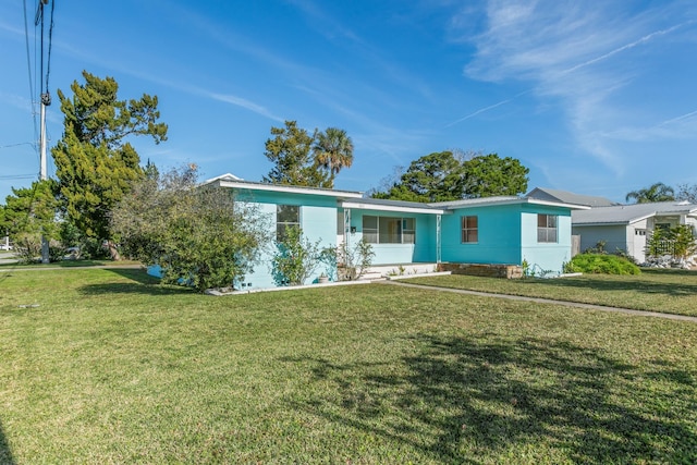 ranch-style home with a front yard