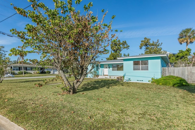 ranch-style house featuring a front lawn