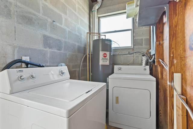 washroom with separate washer and dryer and water heater