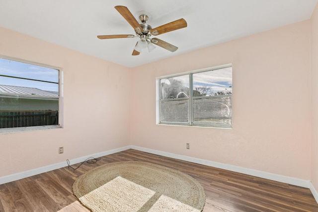 unfurnished room featuring ceiling fan and hardwood / wood-style flooring