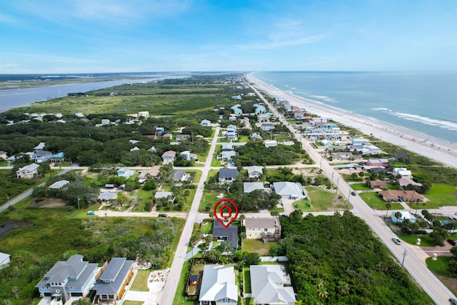 bird's eye view with a water view and a view of the beach