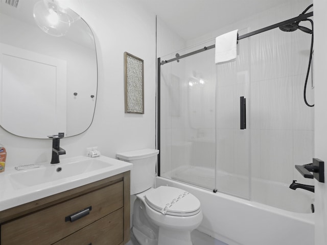 full bathroom with visible vents, shower / bath combination with glass door, vanity, and toilet