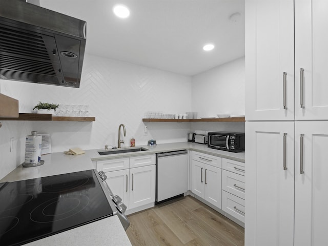 kitchen featuring a sink, white cabinetry, light countertops, appliances with stainless steel finishes, and open shelves