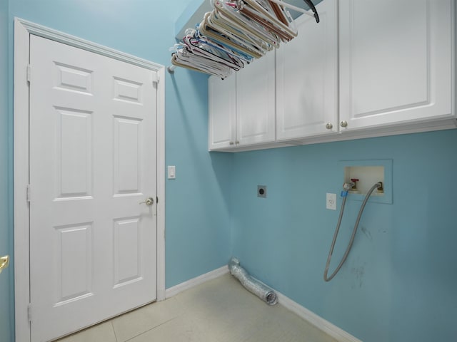 laundry room featuring cabinets, washer hookup, light tile patterned floors, and electric dryer hookup