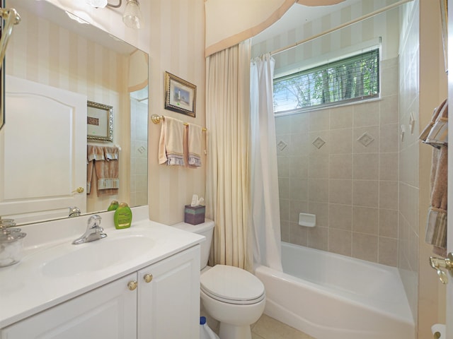 full bathroom featuring shower / bath combo with shower curtain, vanity, and toilet