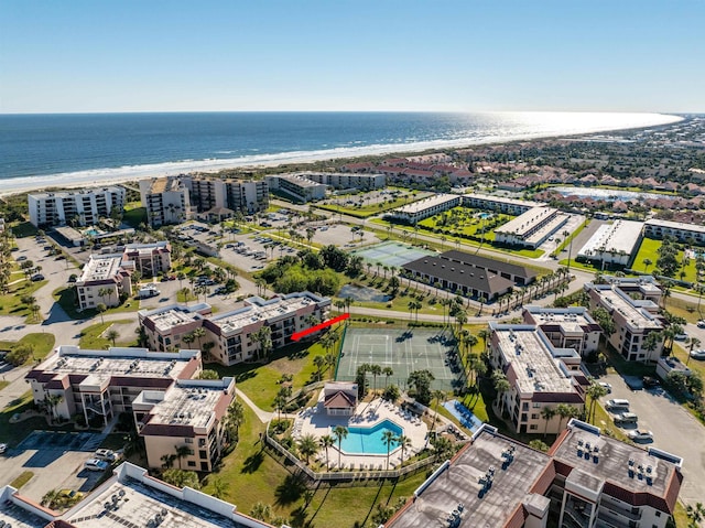 bird's eye view with a water view and a view of the beach