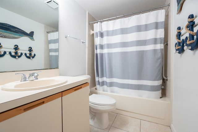 full bathroom featuring tile patterned floors, vanity, shower / bath combination with curtain, and toilet