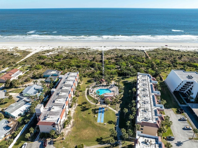 drone / aerial view with a water view and a view of the beach