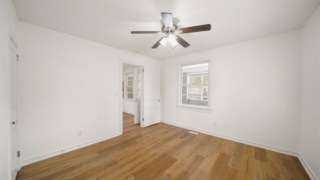 819 Mcduff Ave, Jacksonville, FL 32205 - unfurnished bedroom featuring light wood-style flooring, baseboards, and ceiling fan