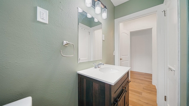 819 Mcduff Ave, Jacksonville, FL 32205 - bathroom featuring a textured wall, vanity, toilet, and wood finished floors