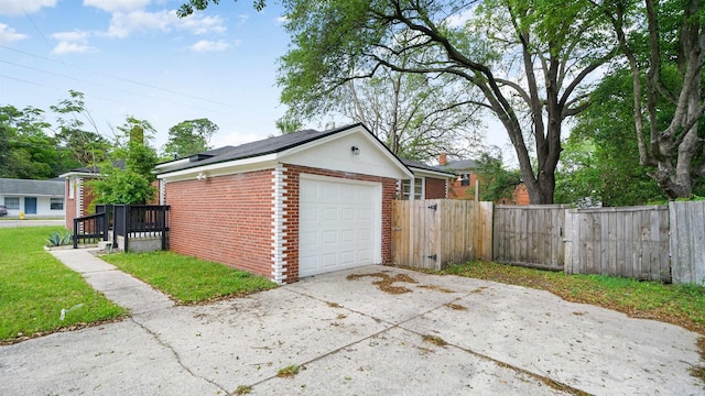 819 Mcduff Ave, Jacksonville, FL 32205 - garage with concrete driveway, fence, and a gate