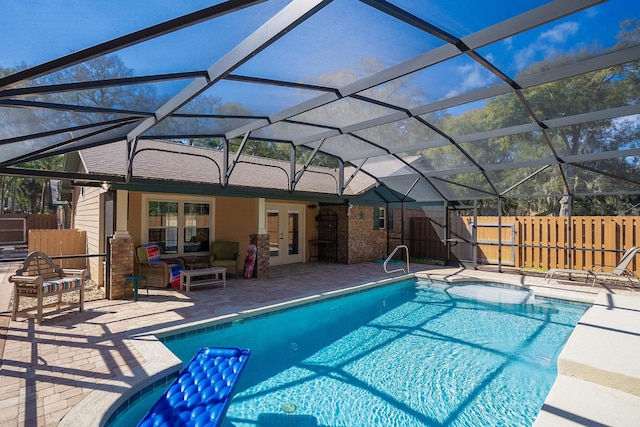 view of pool with a fenced in pool, french doors, fence, and a patio