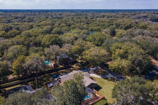 birds eye view of property with a view of trees