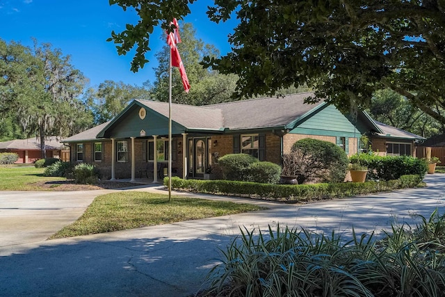 ranch-style house with brick siding