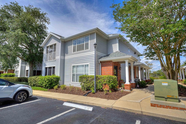 23213 Harbour Vista Cir, Saint Augustine, FL 32080 - view of front facade with uncovered parking and a porch