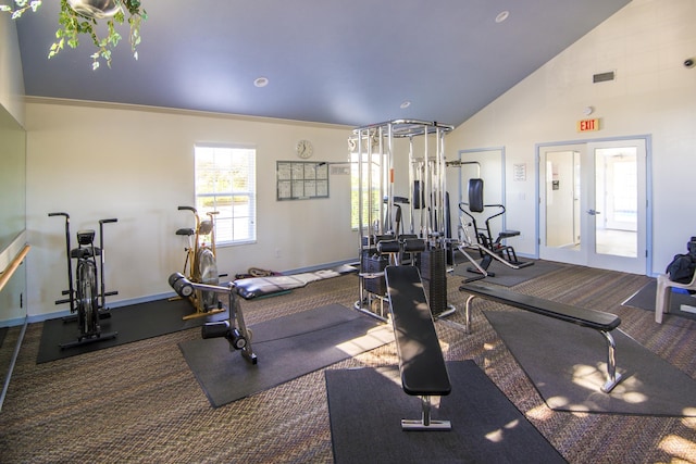 gym featuring french doors, carpet floors, crown molding, and high vaulted ceiling