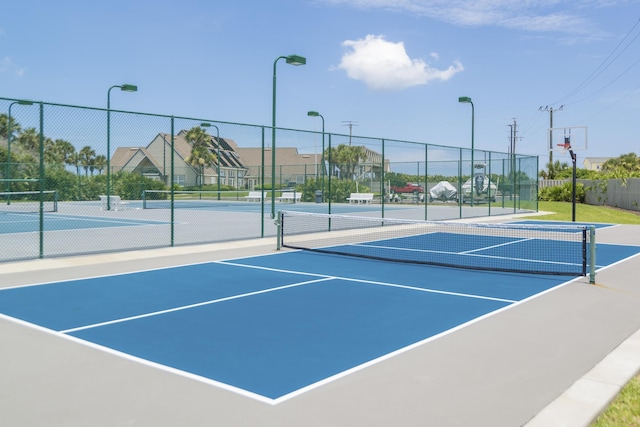 view of sport court with basketball hoop