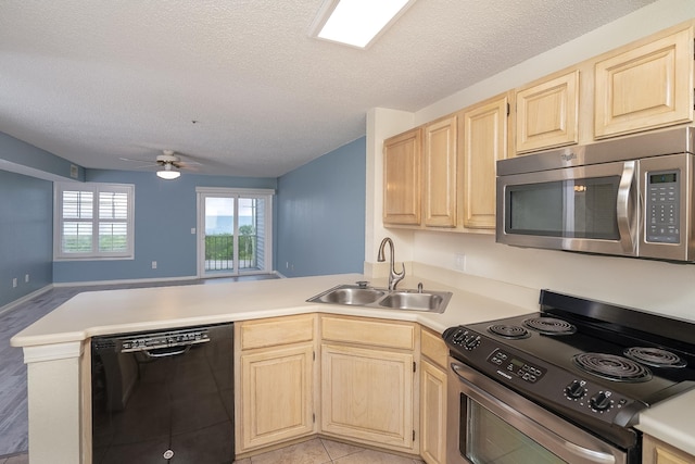 kitchen with appliances with stainless steel finishes, sink, ceiling fan, kitchen peninsula, and light brown cabinets