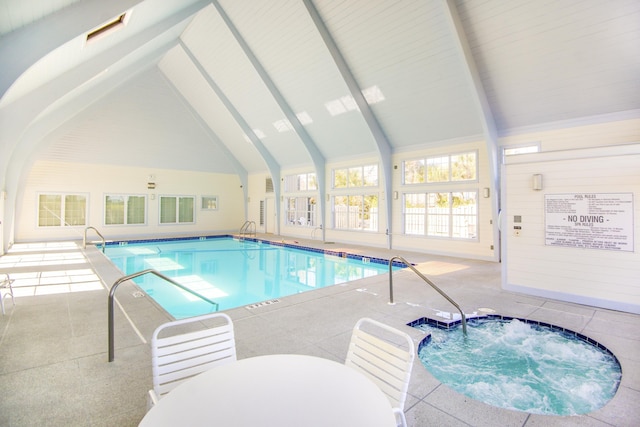 view of swimming pool featuring an indoor hot tub and a patio