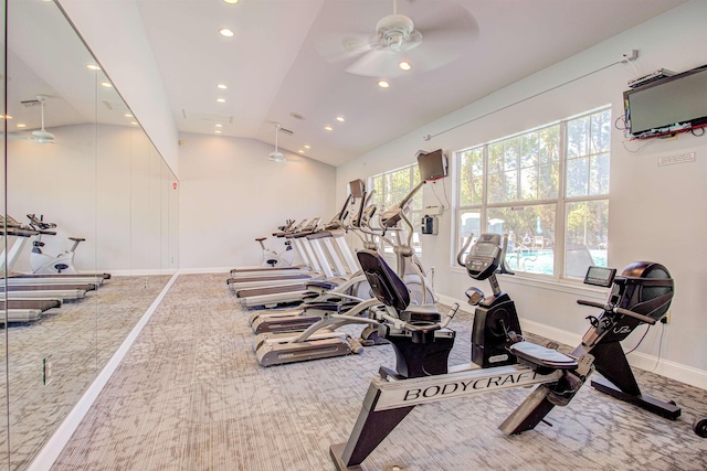 exercise room featuring carpet flooring, vaulted ceiling, and ceiling fan