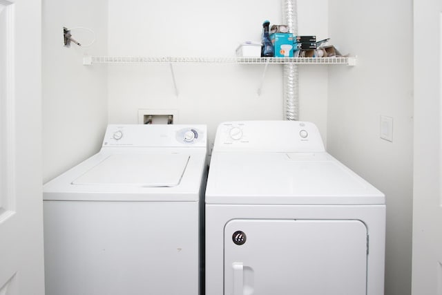 clothes washing area featuring washing machine and clothes dryer