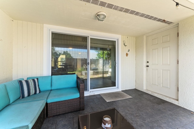 4502 Sandcastle Cir, Saint Augustine, FL 32084 - view of exterior entry featuring outdoor lounge area and a patio
