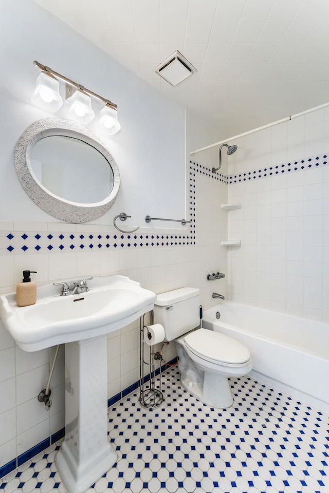 4502 Sandcastle Cir, Saint Augustine, FL 32084 - full bathroom with tile walls, bathing tub / shower combination, and tile patterned flooring
