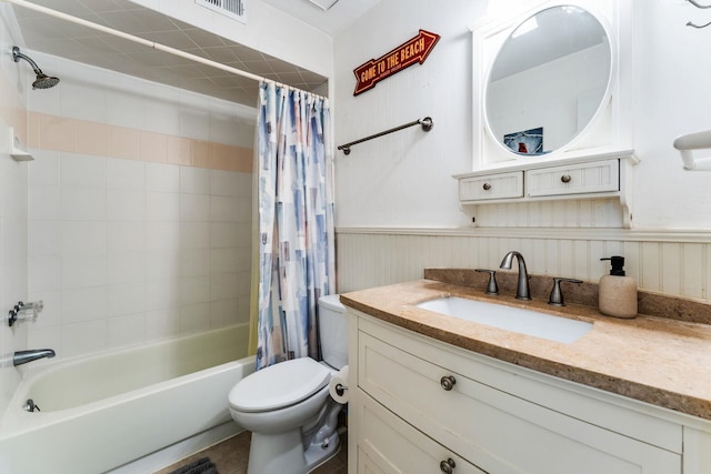 4502 Sandcastle Cir, Saint Augustine, FL 32084 - bathroom with shower / bath combo with shower curtain, vanity, and wainscoting