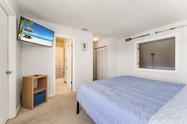 4502 Sandcastle Cir, Saint Augustine, FL 32084 - bedroom featuring light colored carpet, ensuite bath, and a closet