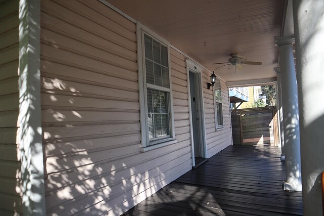 wooden deck featuring ceiling fan and a porch