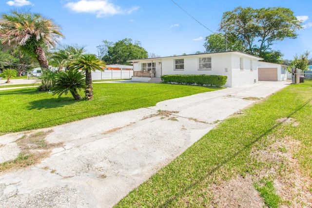 ranch-style home with a front lawn