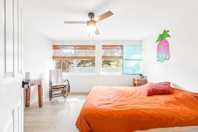 bedroom featuring light hardwood / wood-style flooring and ceiling fan