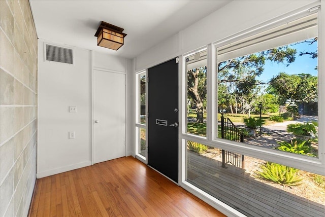 201 Arpieka Ave, Saint Augustine, FL 32080 - doorway to outside featuring plenty of natural light and wood finished floors