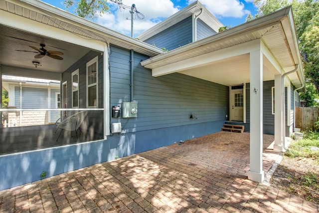 exterior space with ceiling fan